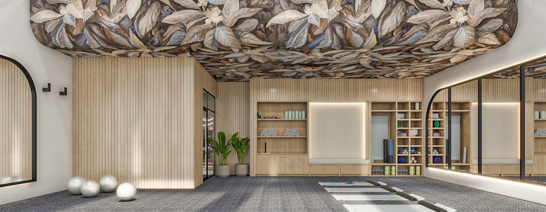 a fitness center with yoga mats and a mirror