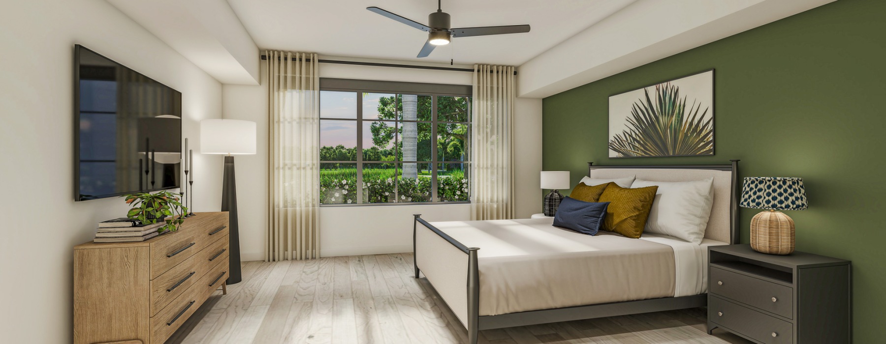 Senior Apartments Near Boynton Beach Mall in Boynton Beach, FL - Boynton Tropical - Bedroom With Ceiling Fan, Wood Style Flooring, Upholstered Bed, And Large Window With Green Views.
