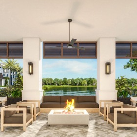 a fire pit in a room overlooking a pond